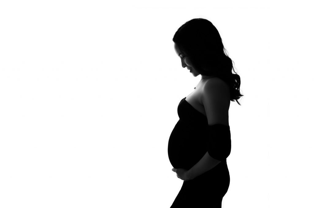 Maternity Photographer Vancouver - pregnant woman posing in black and white