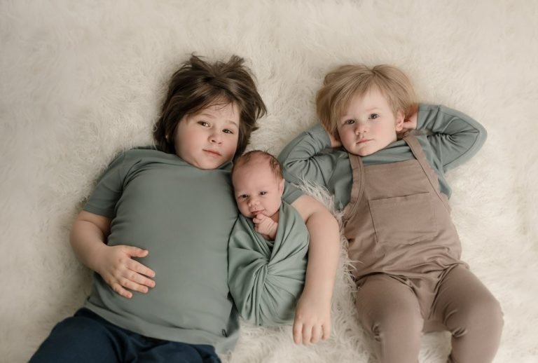 Vancouver Newborn Photoshoot Portrait of two boys and their newborn baby brother