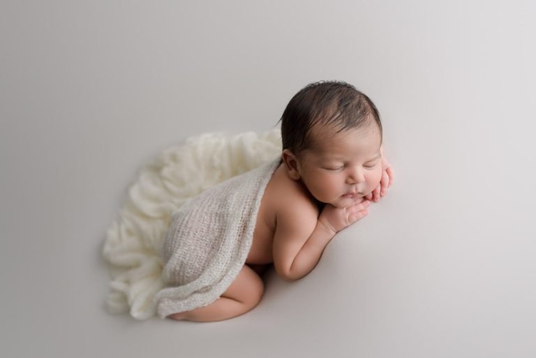North Vancouver Newborn Boy sleeping draped in a white blanket