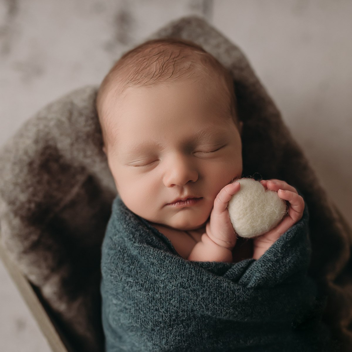 West Vancouver Newborn Photographer, baby boy holding a felt heart