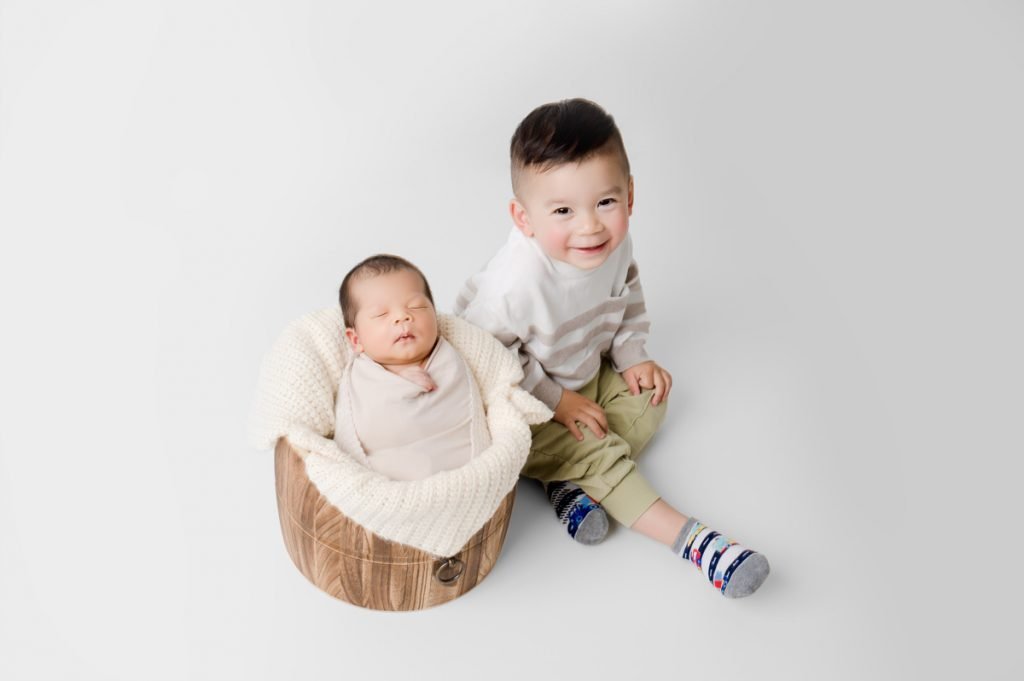 Best Vancouver Newborn Photographer siblings big brother with newborn