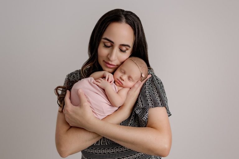 Vancouver Newborn Baby Being Held By Her Mom
