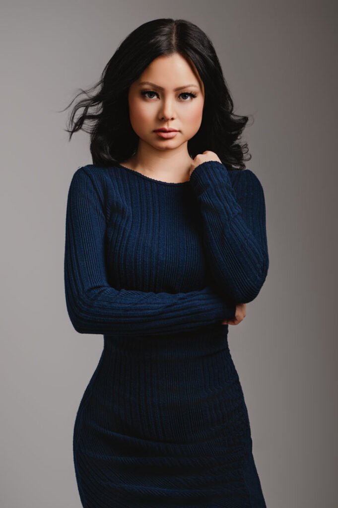 Portrait of a woman wearing a blue dress