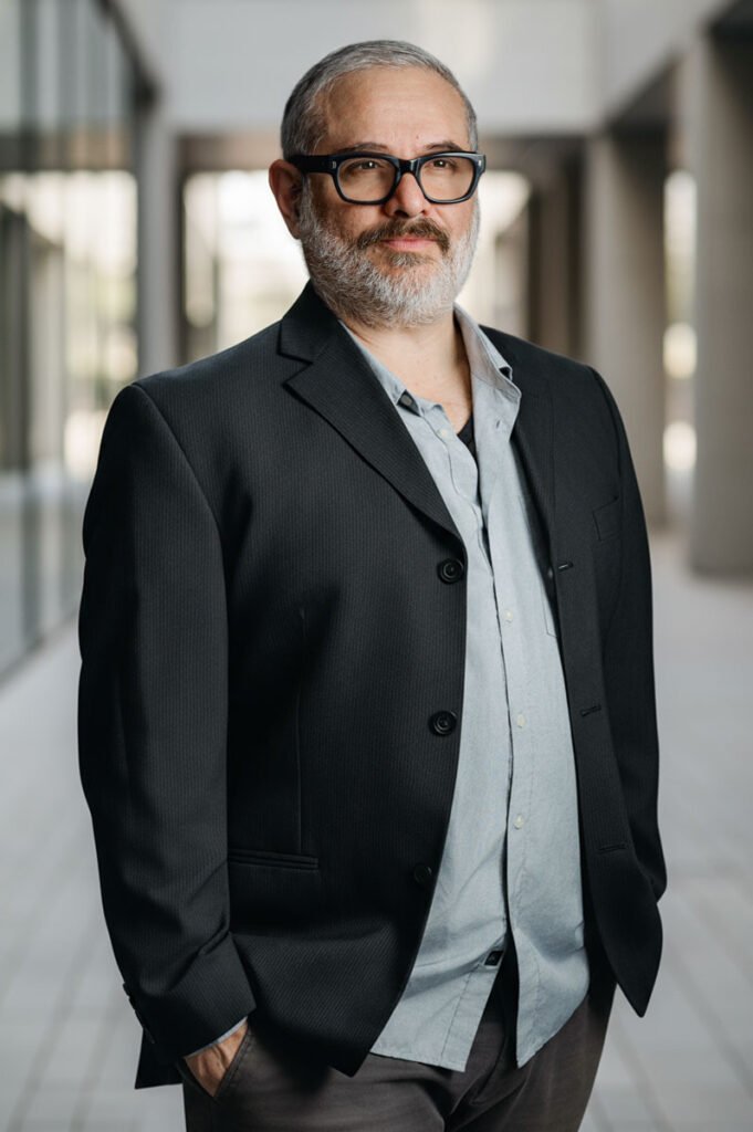 Male Headshot leaning on wall