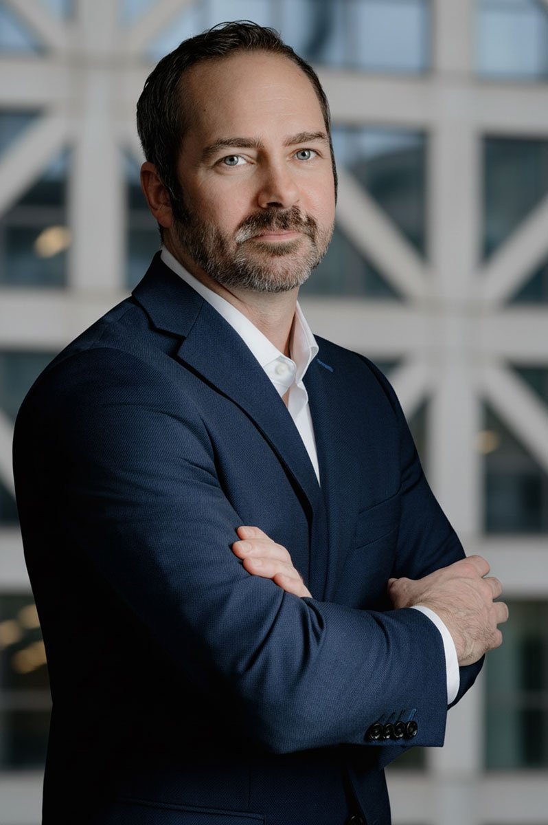 Male Headshot in front of building