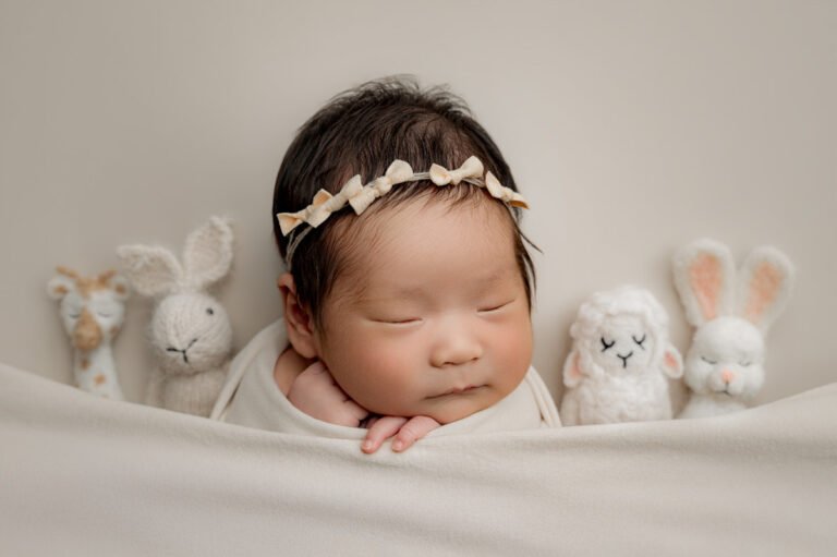 Wrapped newborn baby in a styled setup