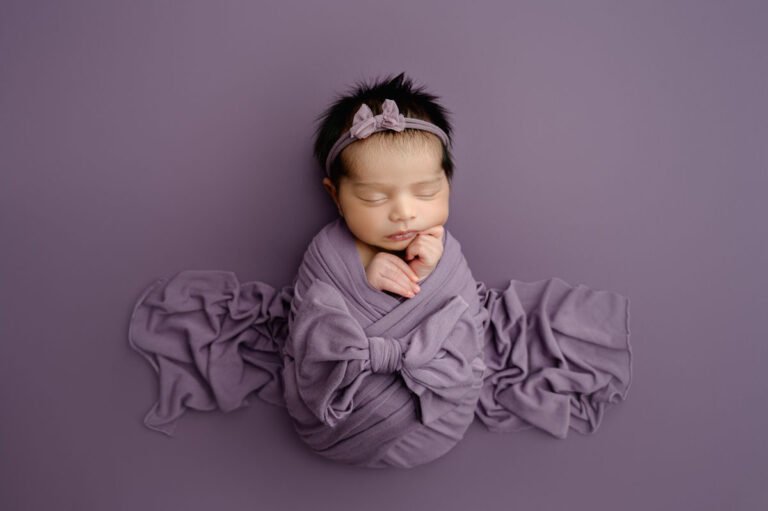 Curled up newborn pose